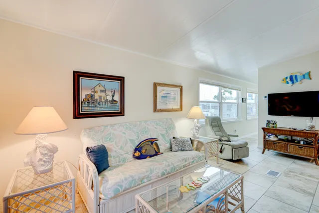 a view of a patio with dining table and chairs