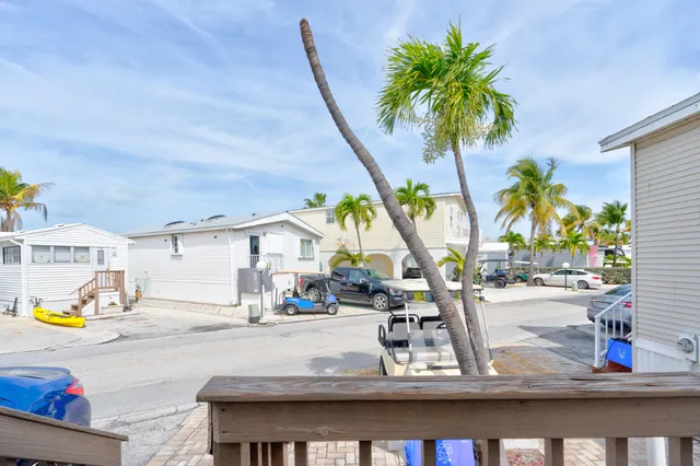 a view of a patio with swimming pool table and chairs