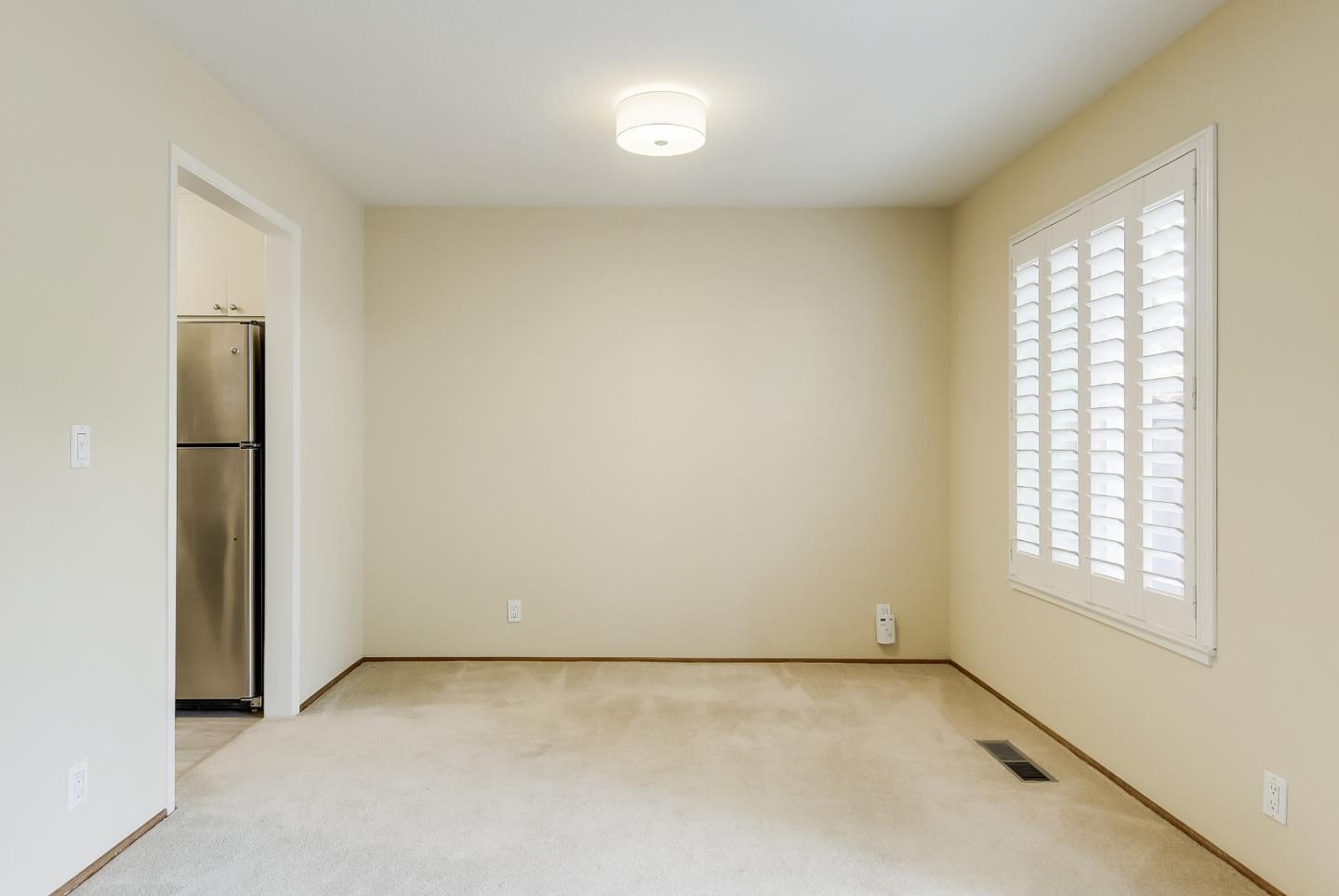 950 Boranda Avenue, Unit 10 Mountain View, CA 94040 - Photo 12 of 20 an empty room with windows