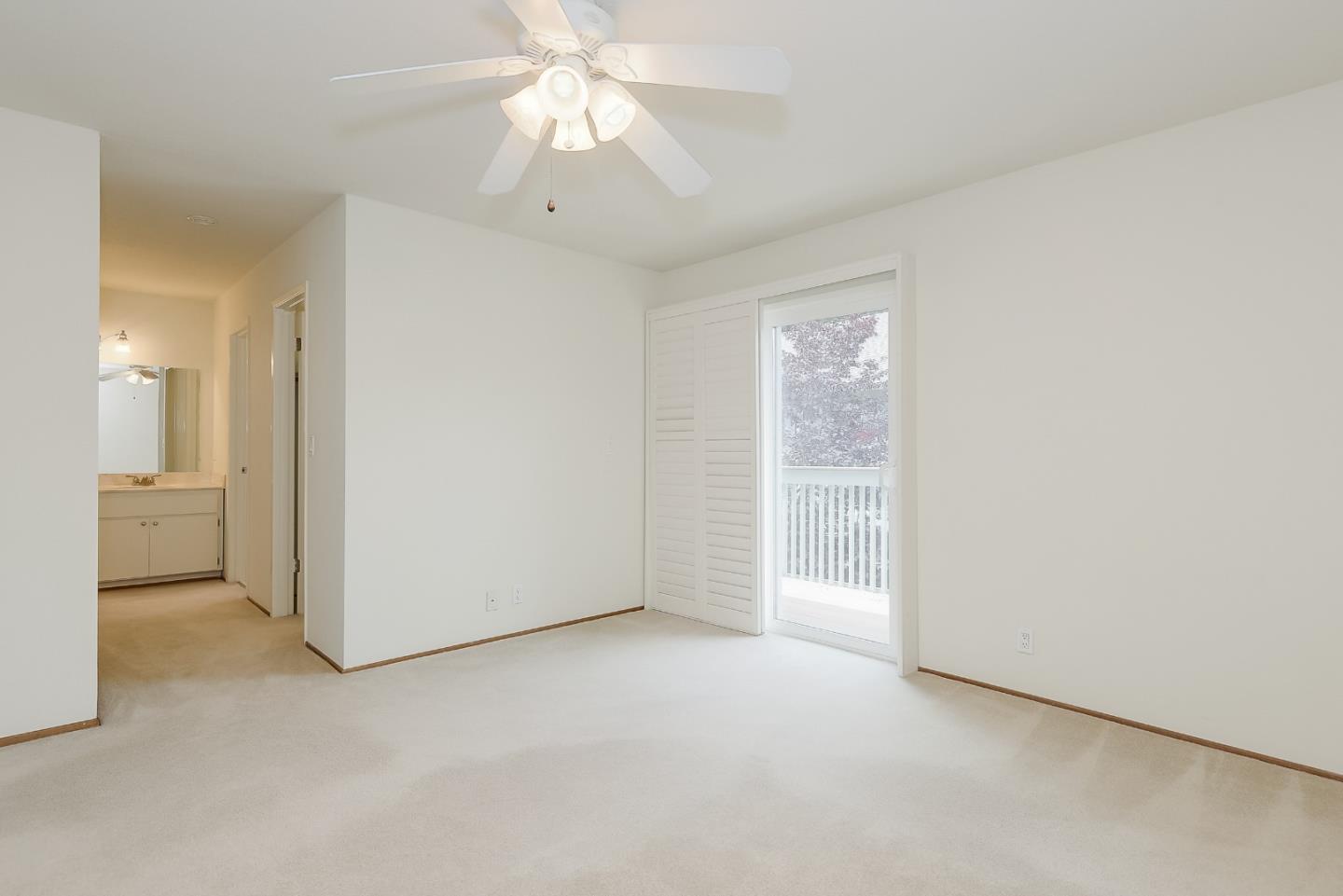 950 Boranda Avenue, Unit 10 Mountain View, CA 94040 - Photo 15 of 20 an empty room with a ceiling fan and a bathroom