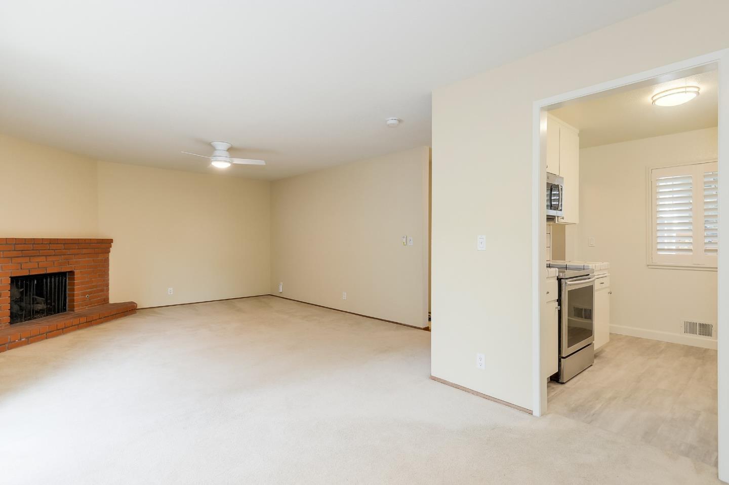 950 Boranda Avenue, Unit 10 Mountain View, CA 94040 - Photo 9 of 20 a view of an empty room with a window