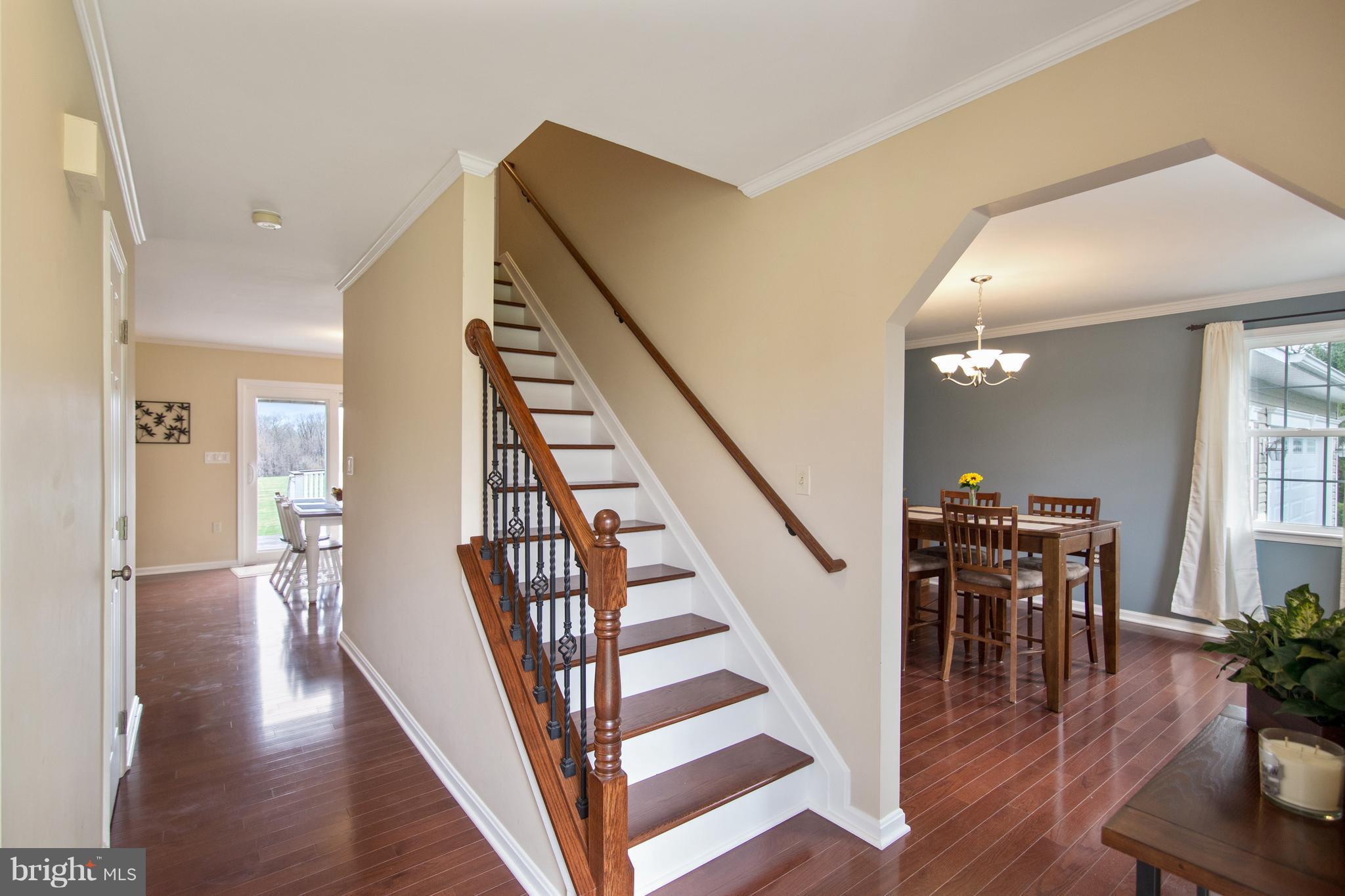 1772 Bloom Road Westminster, MD 21157 - Photo 2 of 30 a view of a hallway with wooden floor and staircase