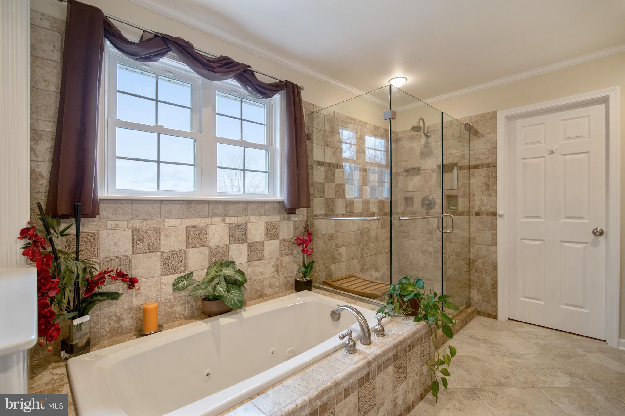 1772 Bloom Road Westminster, MD 21157 - Photo 12 of 30 a bathroom with a bathtub and a shower