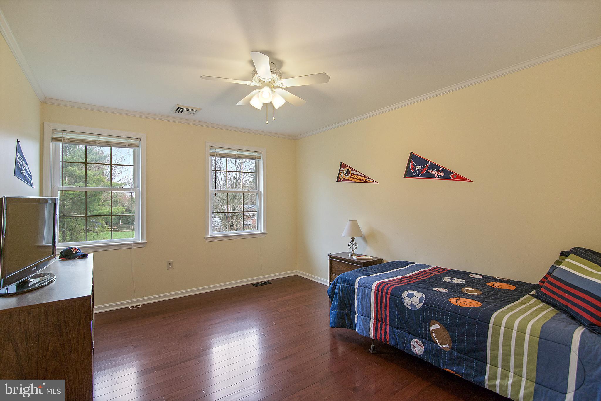1772 Bloom Road Westminster, MD 21157 - Photo 14 of 30 a bedroom with a bed and wooden floor