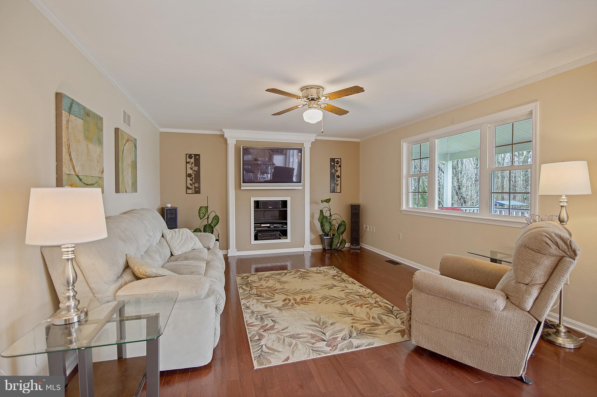 1772 Bloom Road Westminster, MD 21157 - Photo 18 of 30 a living room with furniture a fireplace and a flat screen tv