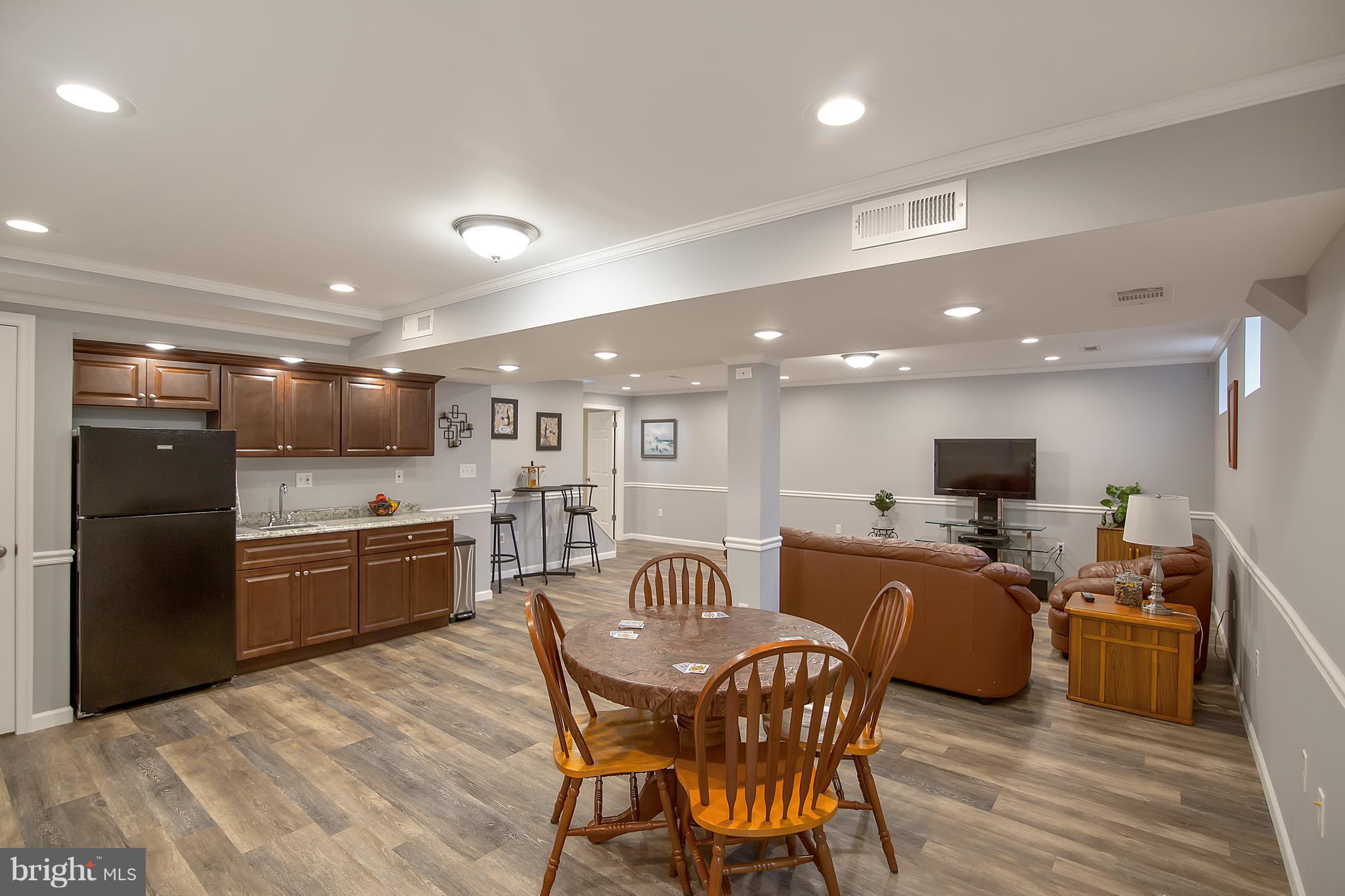 1772 Bloom Road Westminster, MD 21157 - Photo 19 of 30 a kitchen with stainless steel appliances granite countertop a refrigerator a stove a sink a dining table and chairs