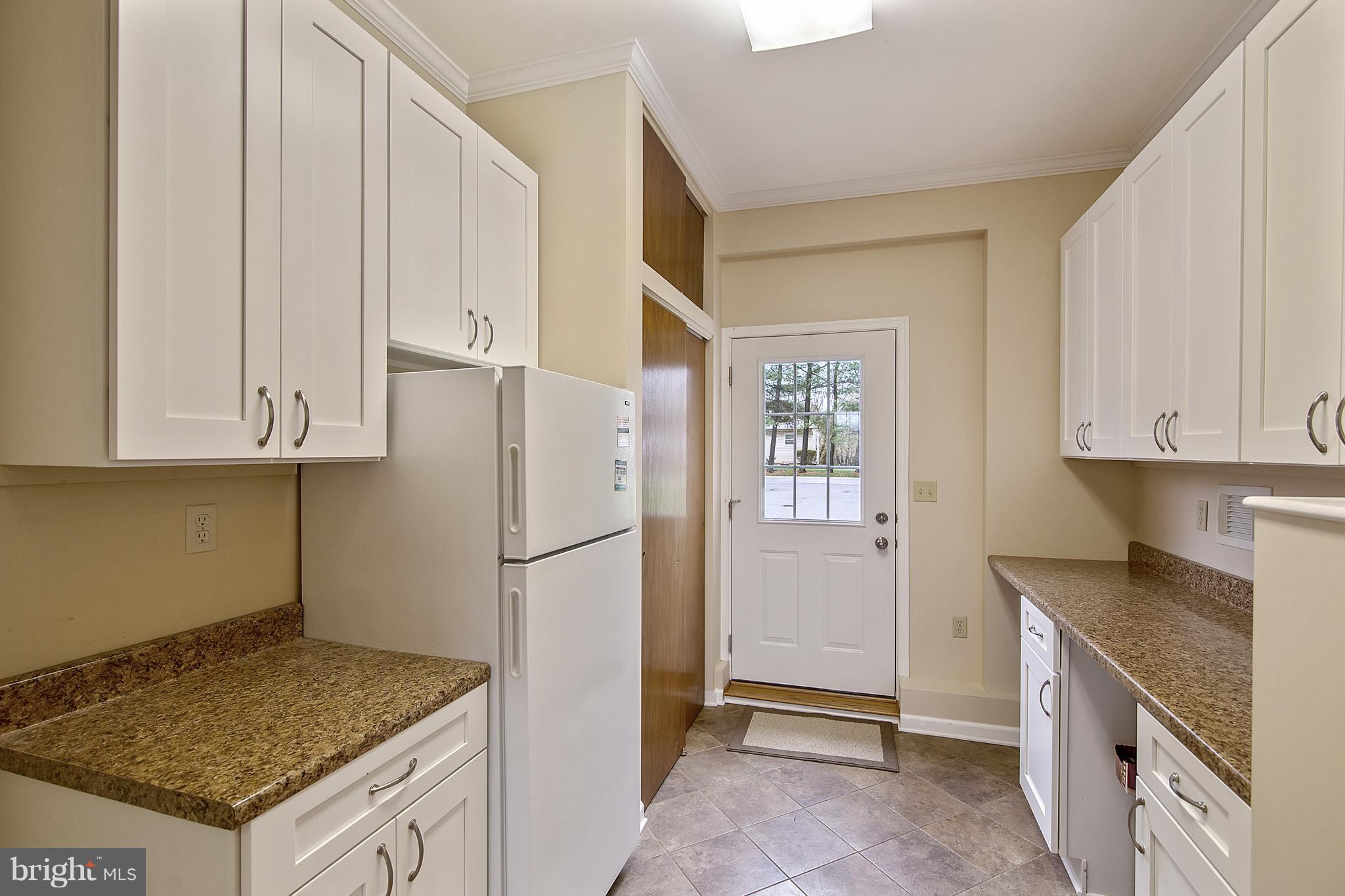 1772 Bloom Road Westminster, MD 21157 - Photo 24 of 30 a kitchen with refrigerator and cabinets