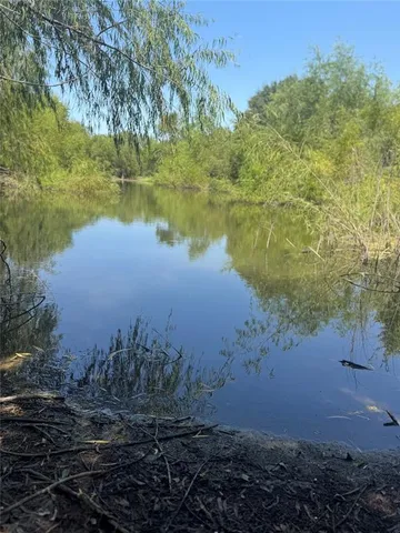 a view of lake with green space