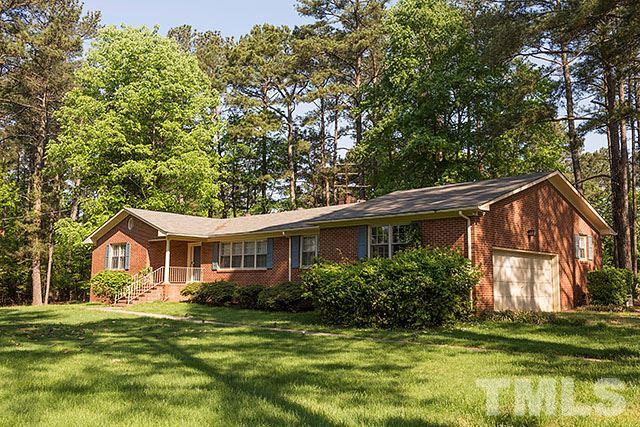2709 Baptist Road Durham, NC 27703 - Photo 1 of 25 a front view of a house with a garden