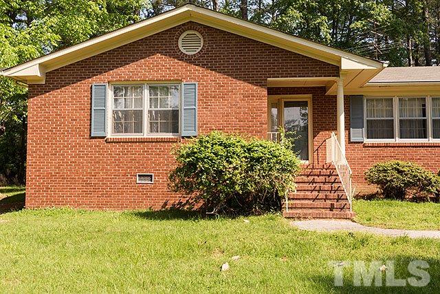 2709 Baptist Road Durham, NC 27703 - Photo 2 of 25 a front view of a house with a yard