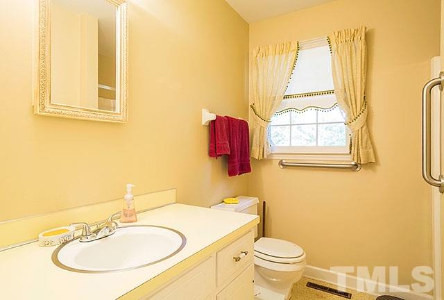 2709 Baptist Road Durham, NC 27703 - Photo 14 of 25 a bathroom with a sink and a toilet
