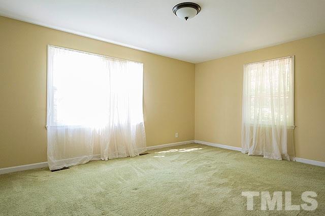 2709 Baptist Road Durham, NC 27703 - Photo 18 of 25 an empty room with windows
