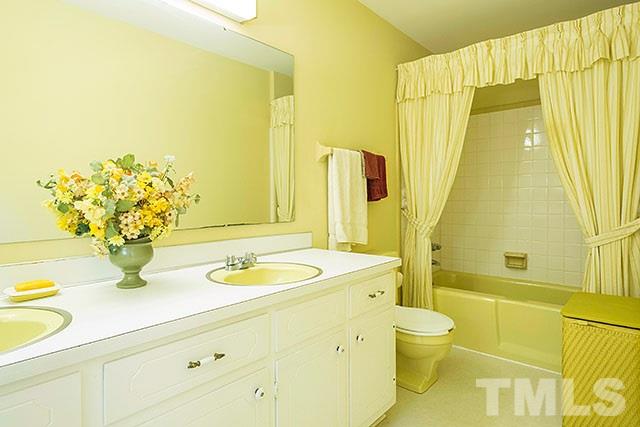 2709 Baptist Road Durham, NC 27703 - Photo 19 of 25 a bathroom with a granite countertop sink and a mirror