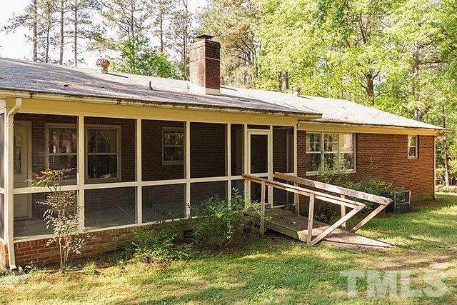 2709 Baptist Road Durham, NC 27703 - Photo 21 of 25 a view of house with backyard and glass windows