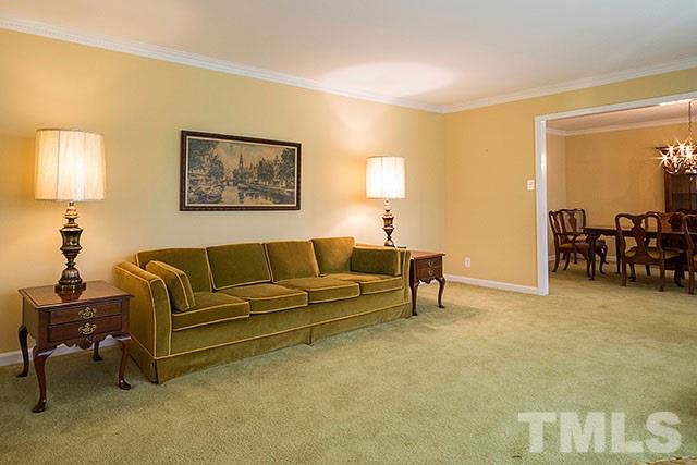 2709 Baptist Road Durham, NC 27703 - Photo 4 of 25 a living room with furniture and a dining area