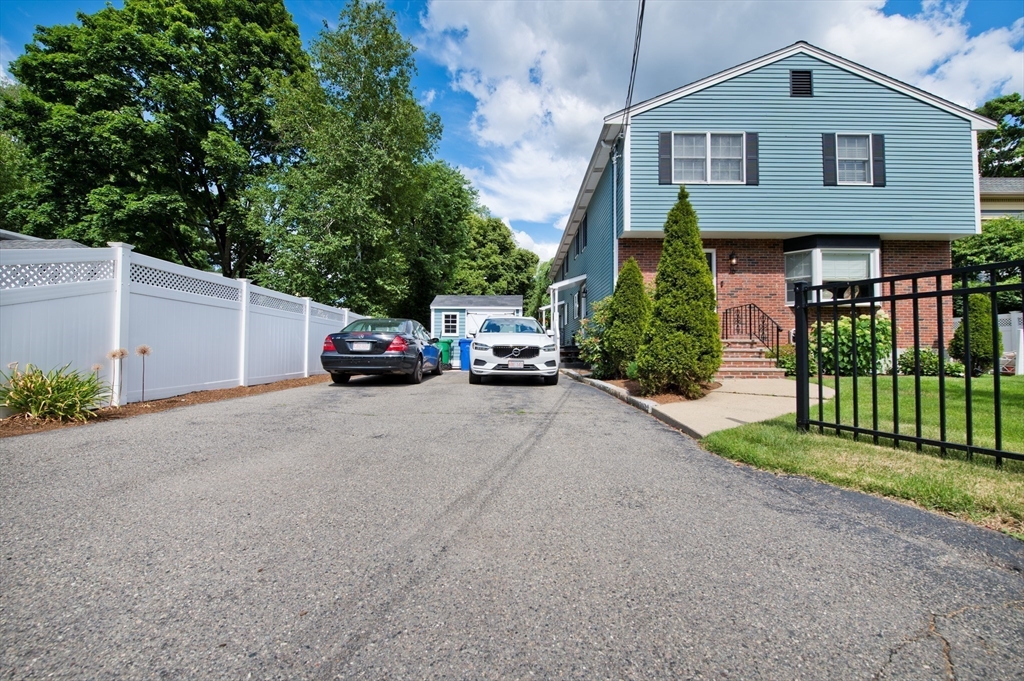 16 Warren Avenue Newton, MA 02465 - Photo 29 of 42 a car parked in front of a house