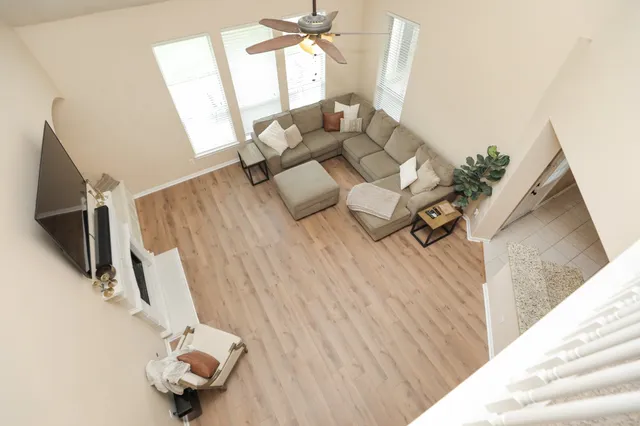 a living room with furniture and a large window