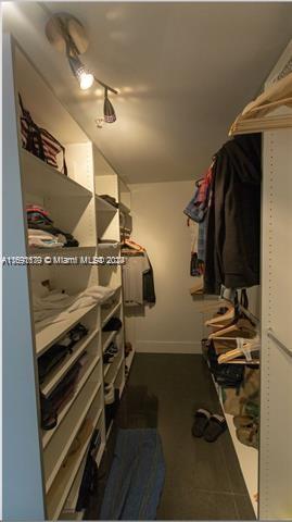 92 Southwest 3rd Street, Unit 1802 Miami, FL 33130 - Photo 17 of 19 a view of walk in closet with clothes and shoes