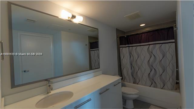 92 Southwest 3rd Street, Unit 1802 Miami, FL 33130 - Photo 9 of 19 a bathroom with a sink toilet and shower