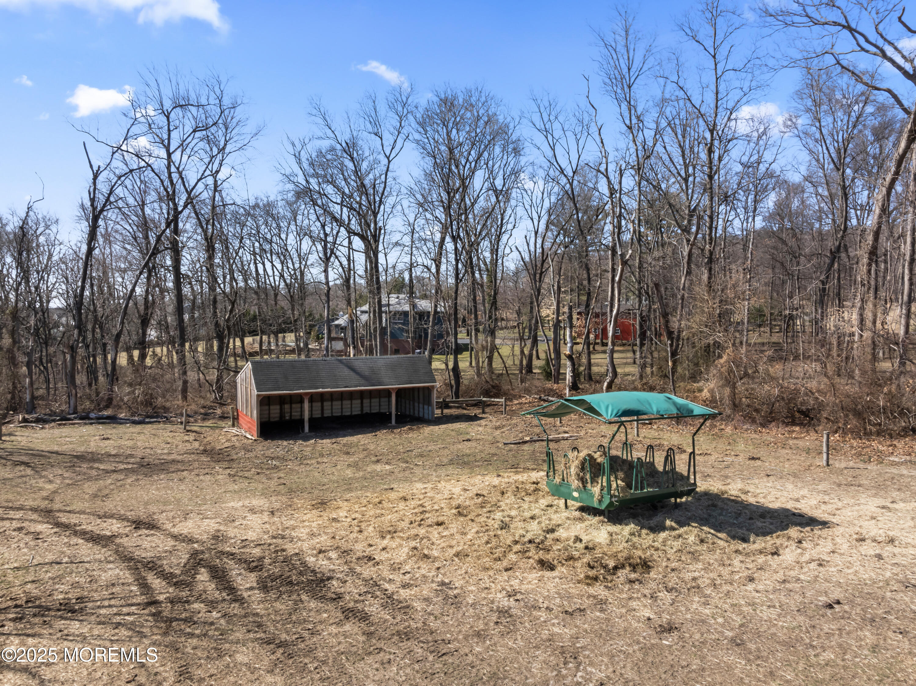 35 Rues Road Cream Ridge, NJ 08514 - Photo 14 of 46 a wooden bench sitting in the middle of a yard