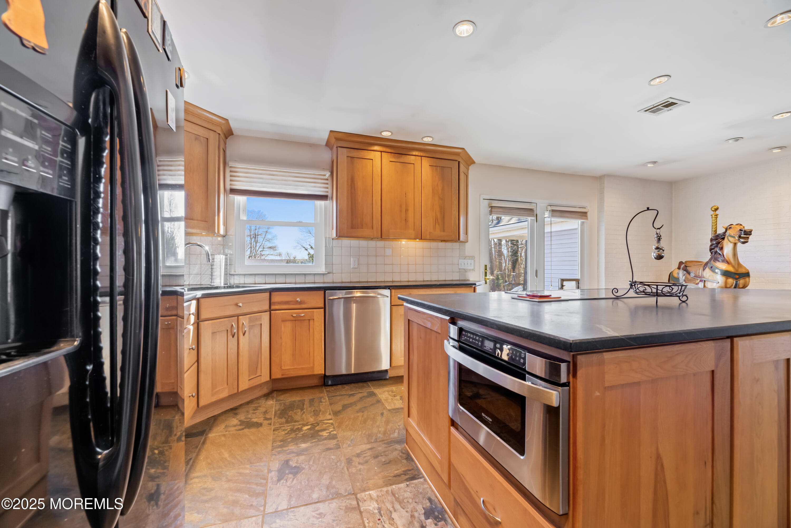 35 Rues Road Cream Ridge, NJ 08514 - Photo 26 of 46 a kitchen with stainless steel appliances granite countertop a sink stove and refrigerator