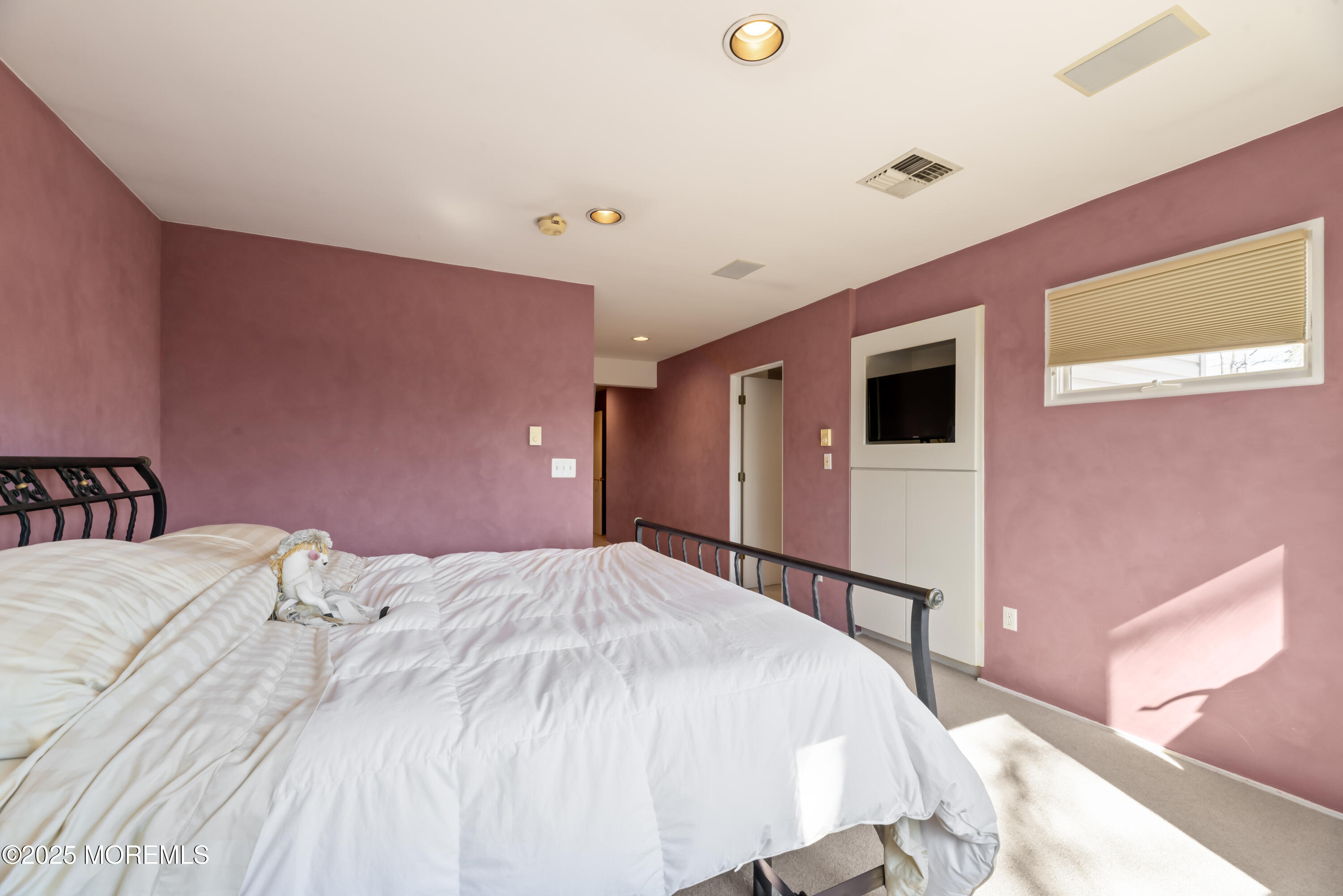35 Rues Road Cream Ridge, NJ 08514 - Photo 36 of 46 a spacious bedroom with a bed and a flat screen tv