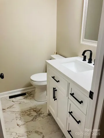 a bathroom with a sink and a toilet