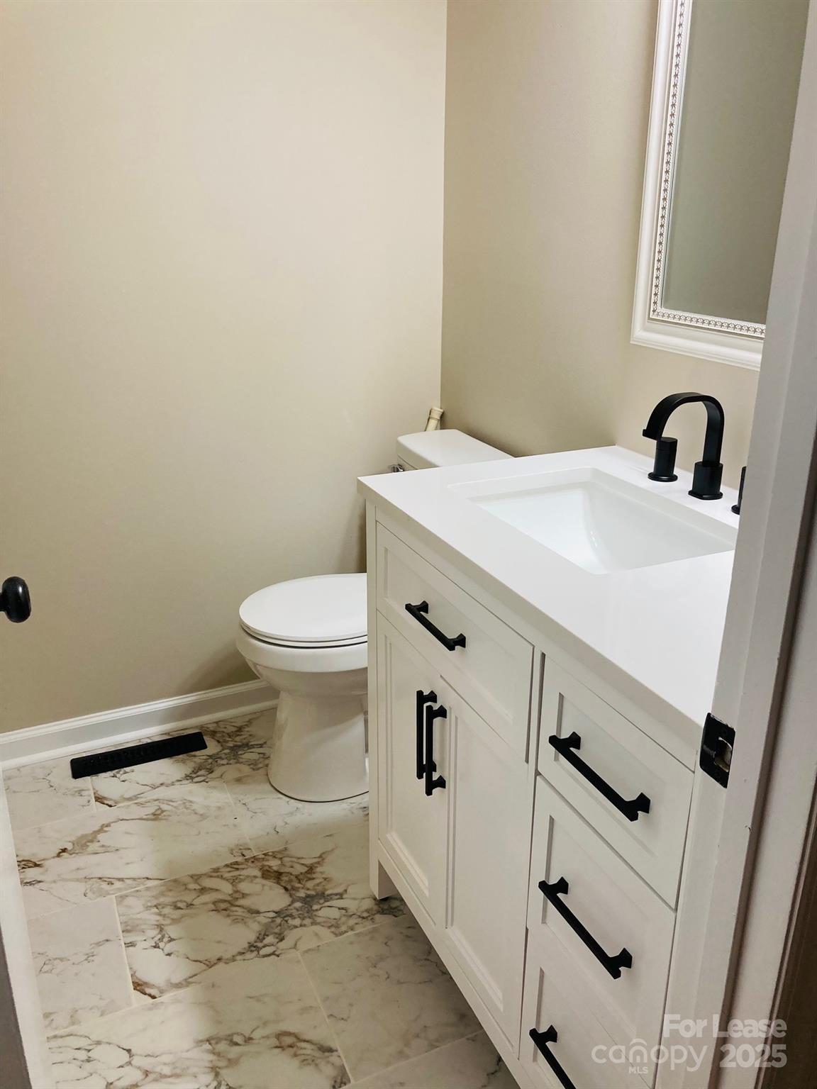 2177 Lynmore Drive Sherrills Ford, NC 28673 - Photo 12 of 18 a bathroom with a sink and a toilet