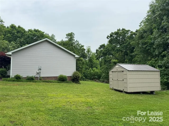 a backyard of a house with lots of green space