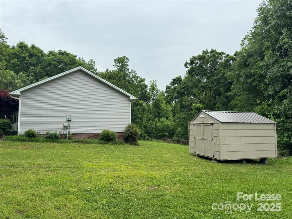 2177 Lynmore Drive Sherrills Ford, NC 28673 - Photo 18 of 18 a backyard of a house with lots of green space