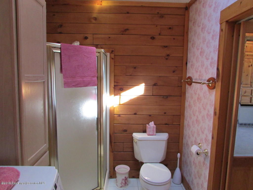 11068 State Rte 3023 Montrose, PA 18801 - Photo 16 of 38 a bathroom with a toilet and a shower