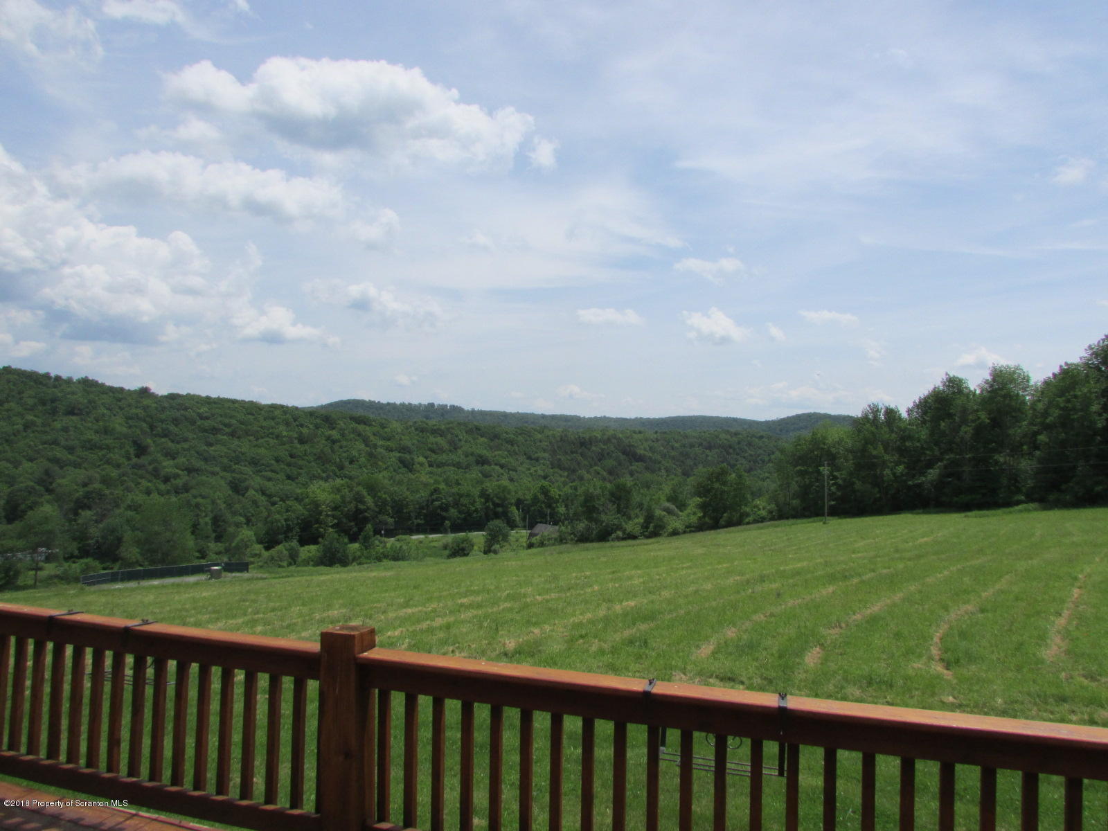 11068 State Rte 3023 Montrose, PA 18801 - Photo 29 of 38 a view of a green field with wooden fence
