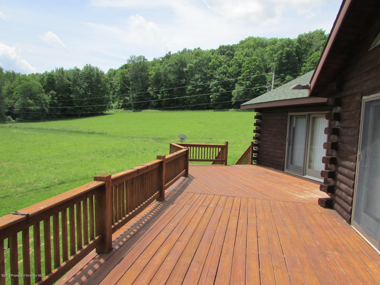 11068 State Rte 3023 Montrose, PA 18801 - Photo 30 of 38 a view of a deck with a yard