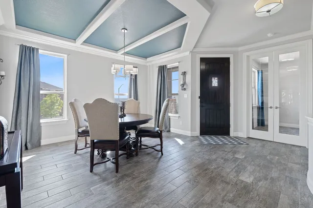 a view of a dining room with furniture and wooden floor
