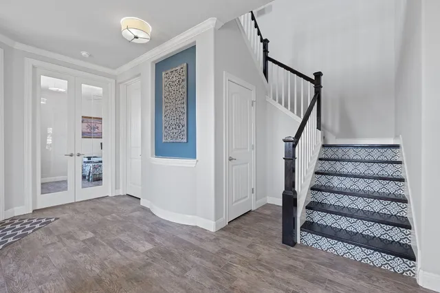 a view of entryway with stairs and wooden floor