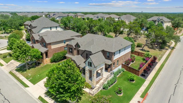 an aerial view of a house with a garden