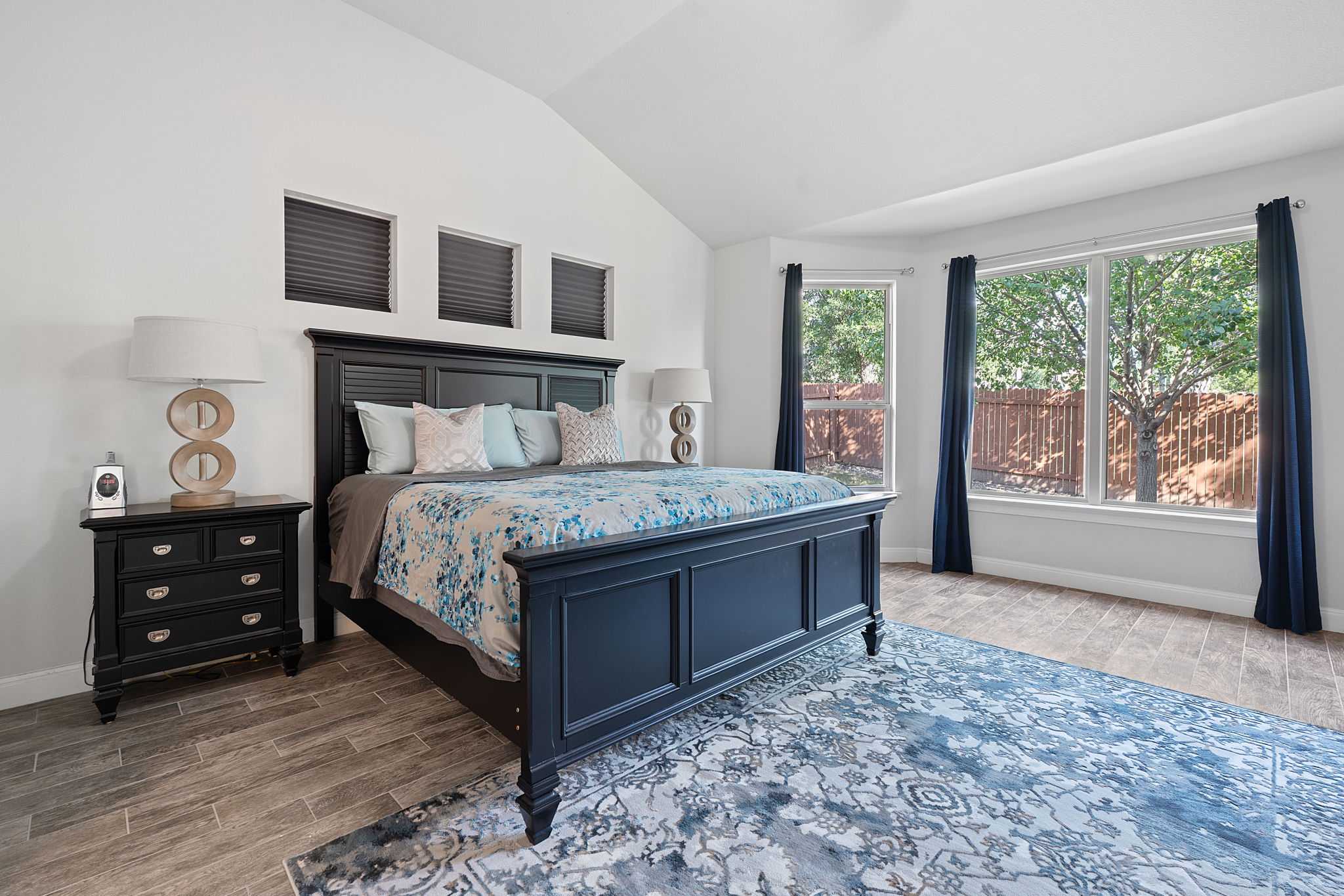 4212 Borho Ranch Street Leander, TX 78641 - Photo 21 of 37 Bedroom with wood tiled floors and vaulted ceiling