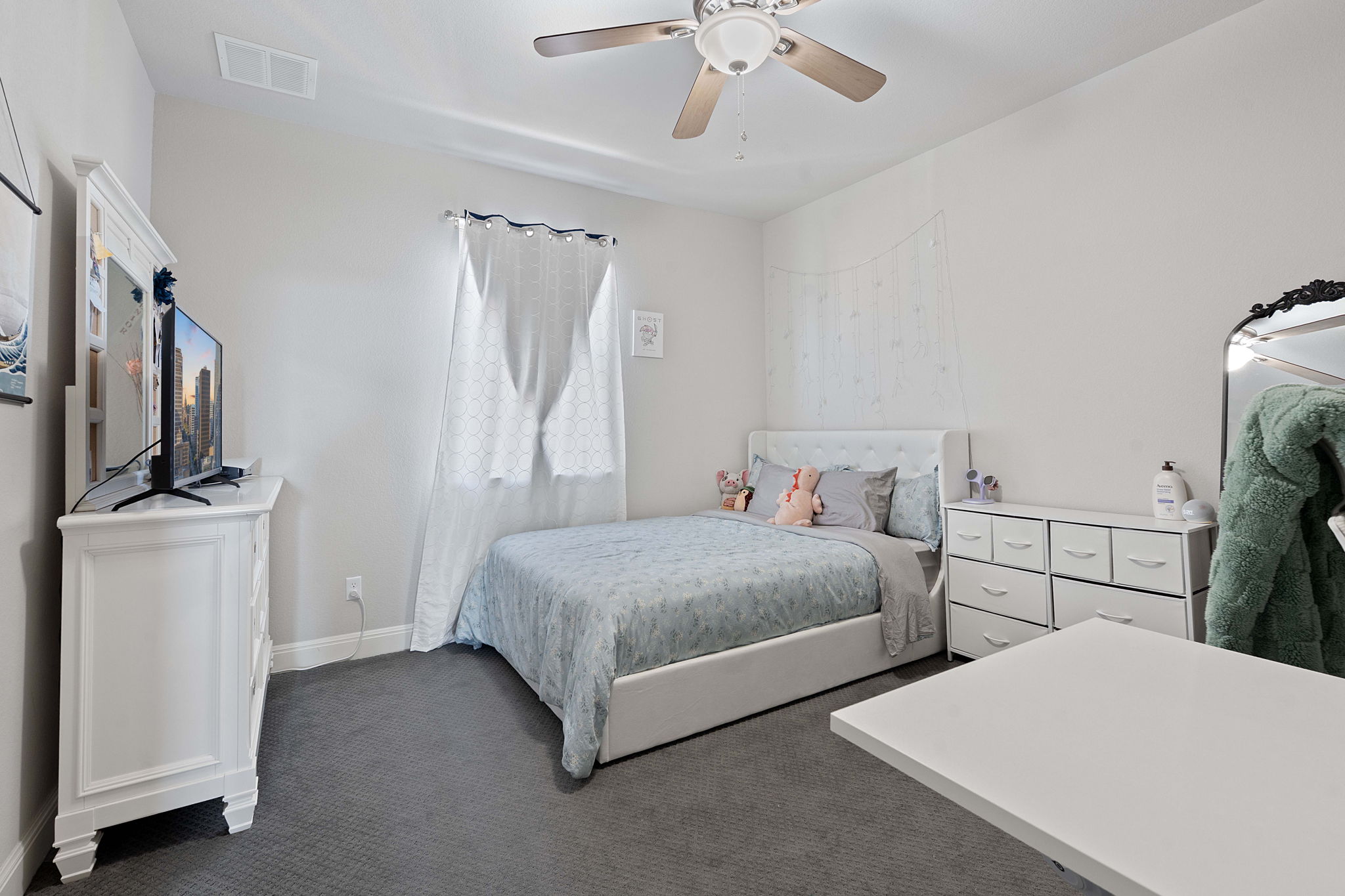 4212 Borho Ranch Street Leander, TX 78641 - Photo 24 of 37 Bedroom with dark carpet and ceiling fan