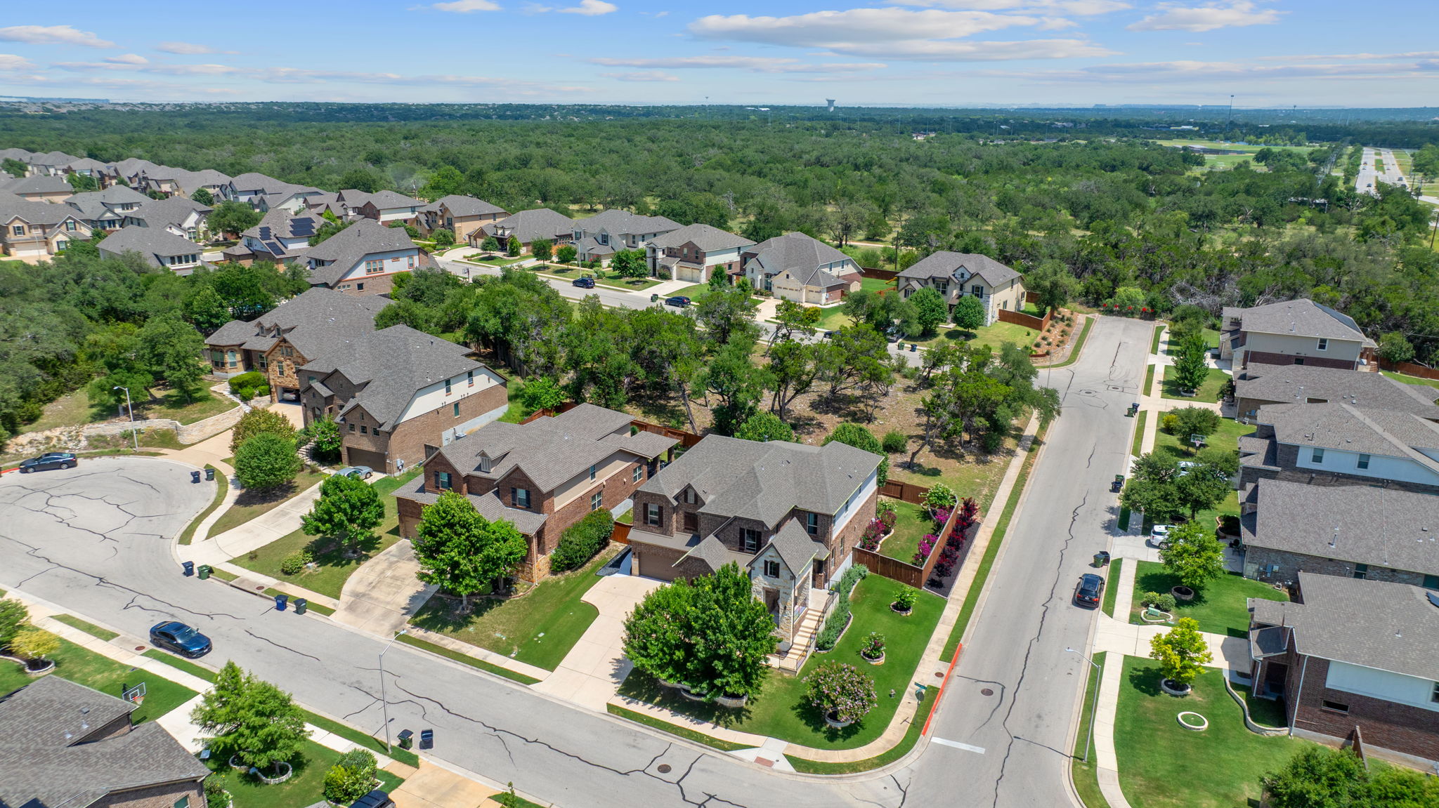 4212 Borho Ranch Street Leander, TX 78641 - Photo 36 of 37 Aerial view of residential area featuring a heavily wooded area