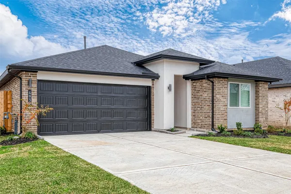 a front view of a house with a garage