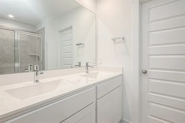 a bathroom with a sink and mirror
