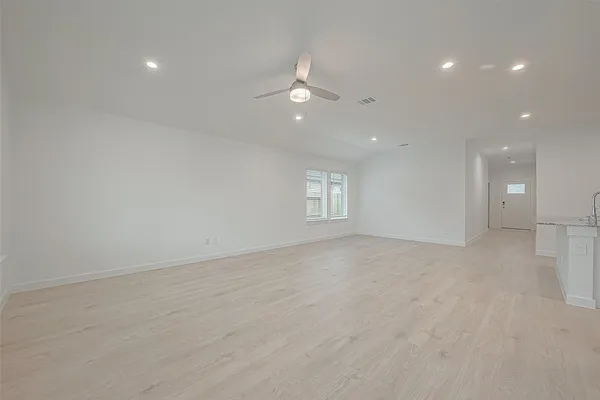 a kitchen with a sink stove and refrigerator