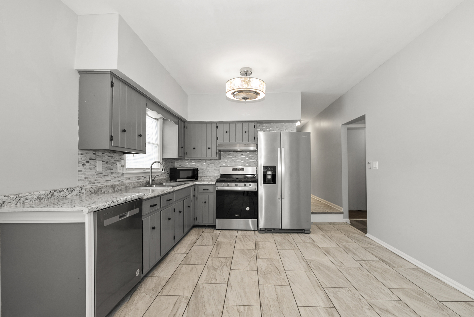 8340 West Lincoln Highway, Unit 8340 Frankfort, IL 60423 - Photo 3 of 12 a kitchen with stainless steel appliances granite countertop a stove cabinets and refrigerator