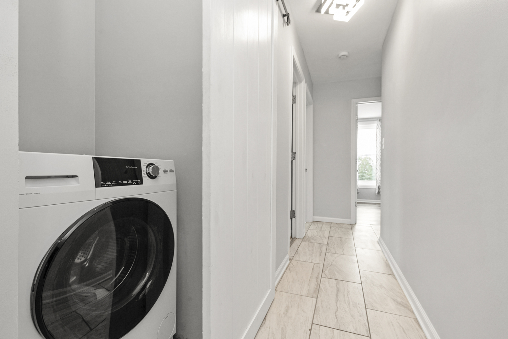 8340 West Lincoln Highway, Unit 8340 Frankfort, IL 60423 - Photo 10 of 12 a view of a hallway with washer and dryer