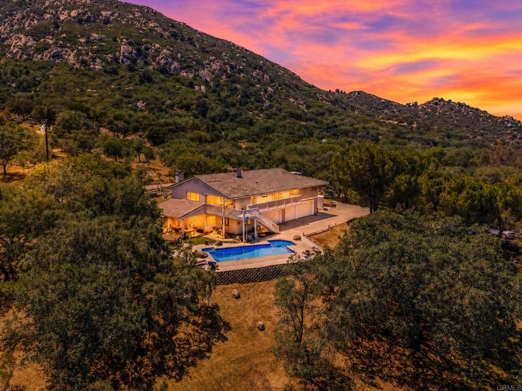 an aerial view of a house with a garden