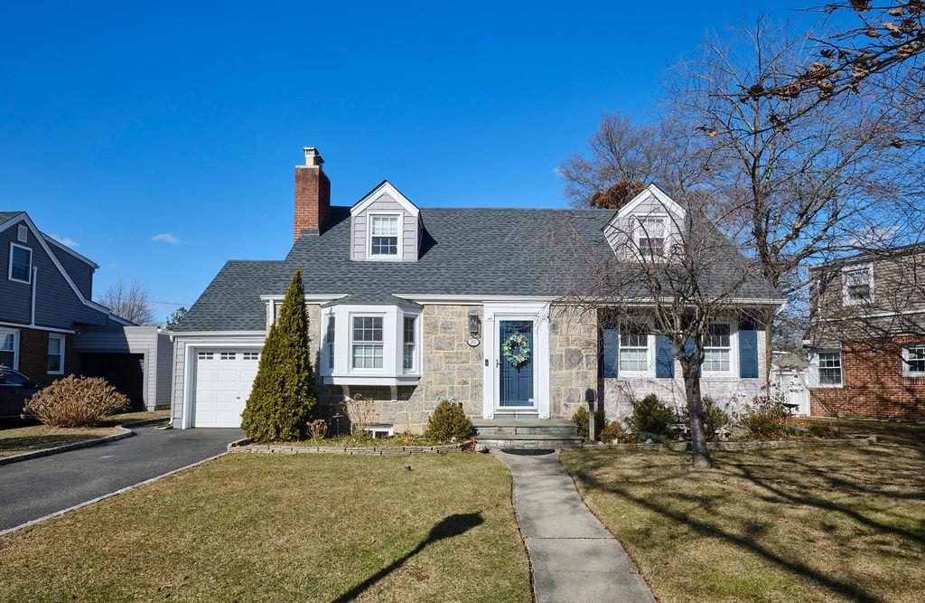 85 Gateway Rockville Centre, NY 11570 - Photo 1 of 1 Cape cod house with a garage and a front lawn