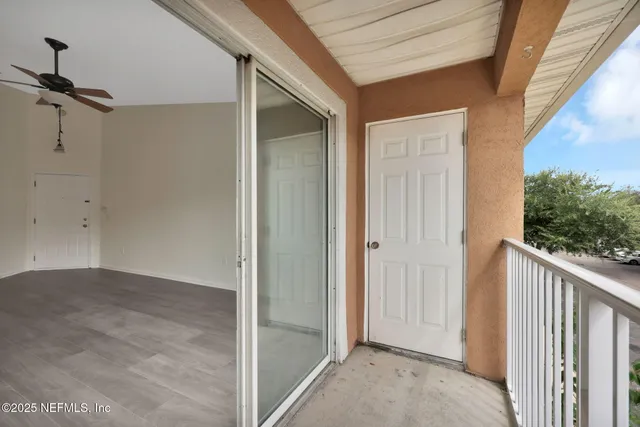 a view of a balcony with chairs