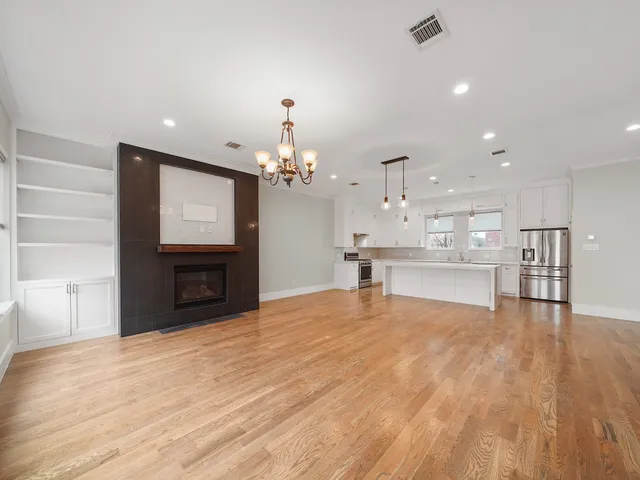 a view of a kitchen with furniture and a flat screen tv
