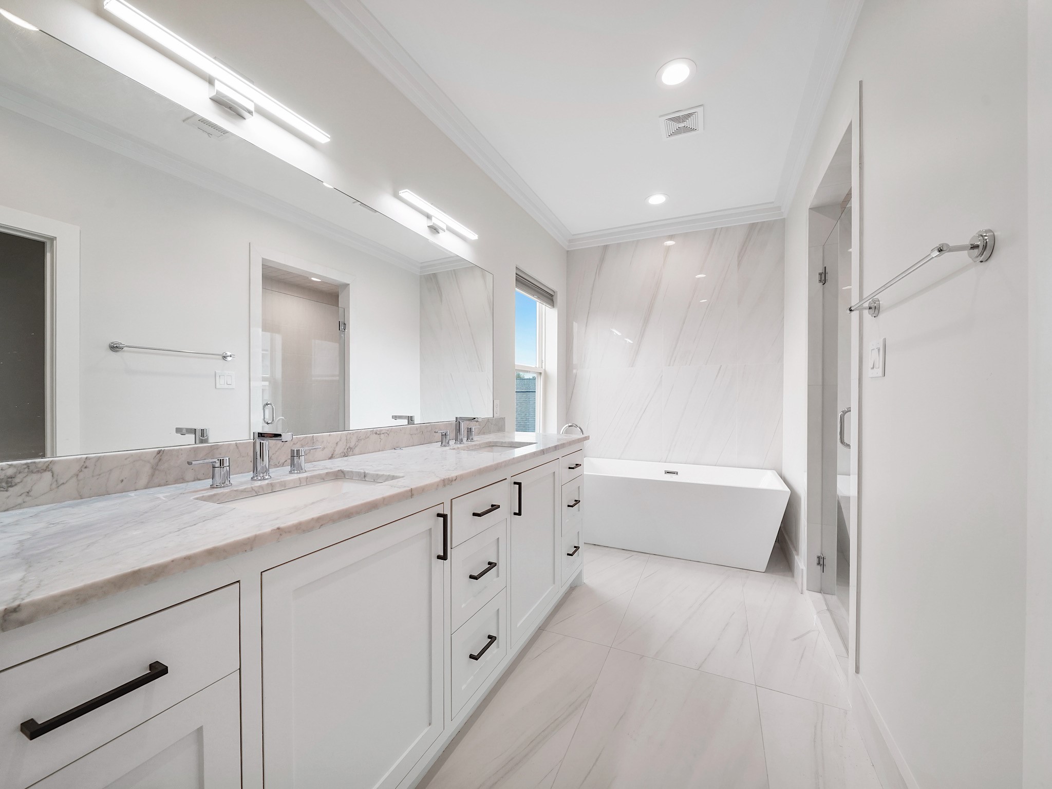 1512 Thompson Street, Unit 2 Houston, TX 77007 - Photo 26 of 39 Primary bathroom with extended dual-sink vanity, abundant storage, and clean, contemporary finishes designed for everyday comfort.
