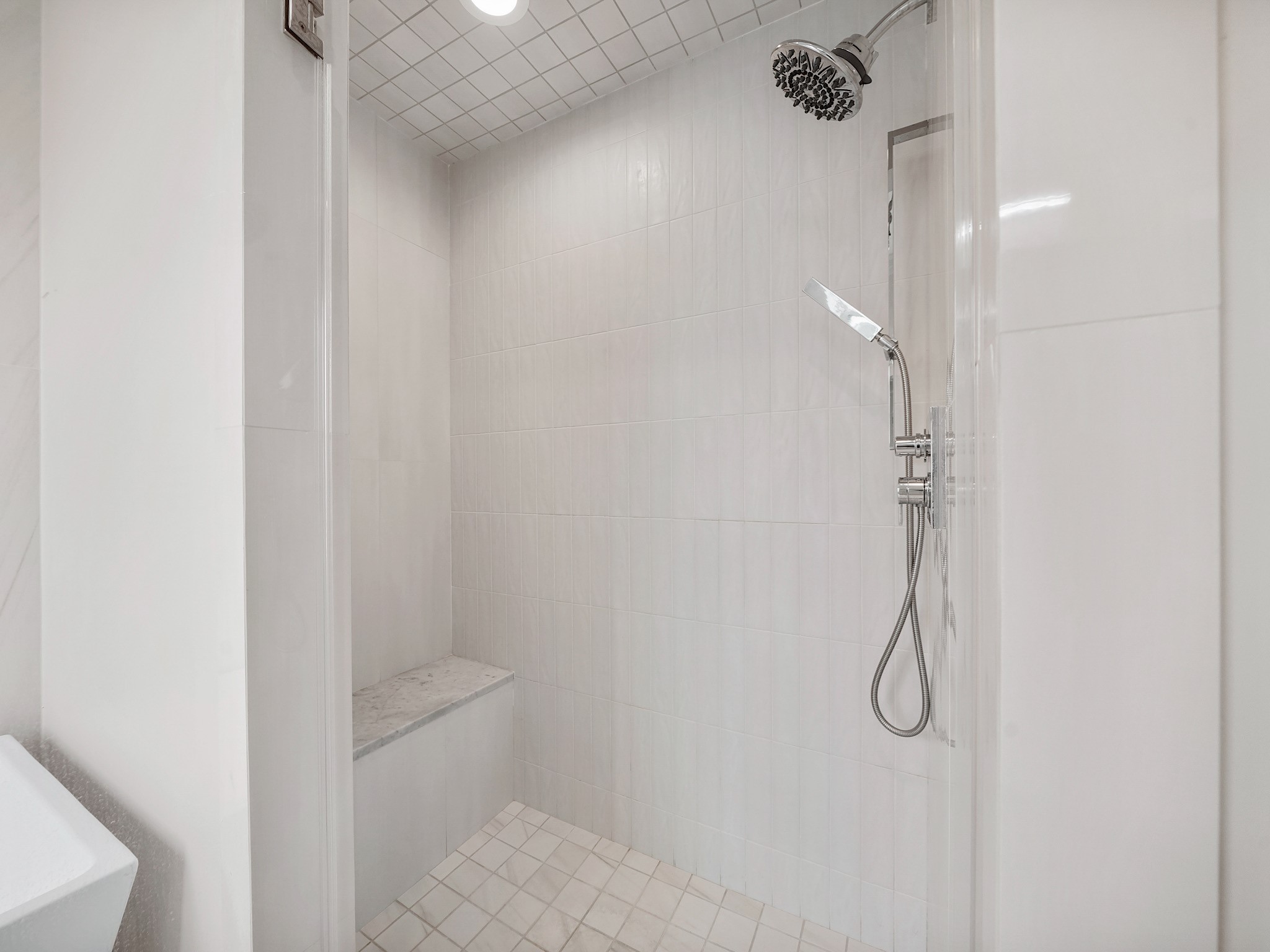 1512 Thompson Street, Unit 2 Houston, TX 77007 - Photo 29 of 39 Separate walk-in shower with sleek tilework and modern fixtures for a polished, hotel-like experience.
